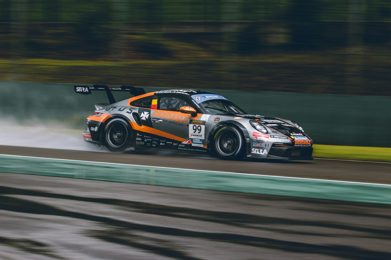 A rally car cornering on gravel